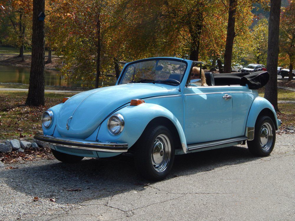 Blue VW Super Beetle with the top down